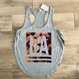 New with tags! Guess Tank Top. High side slits. Size Medium